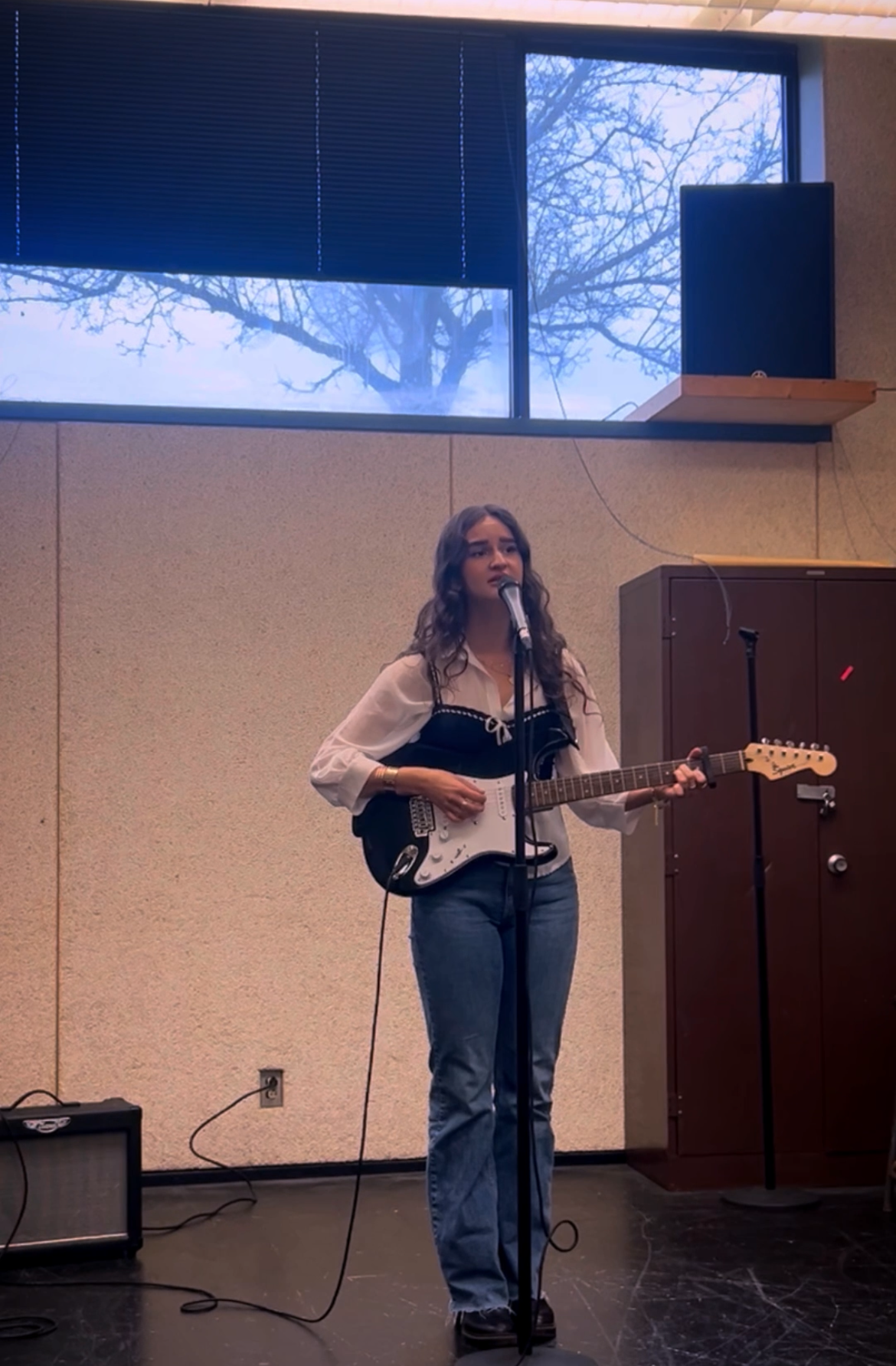 Victoria Brimble performing in a full-length stage image